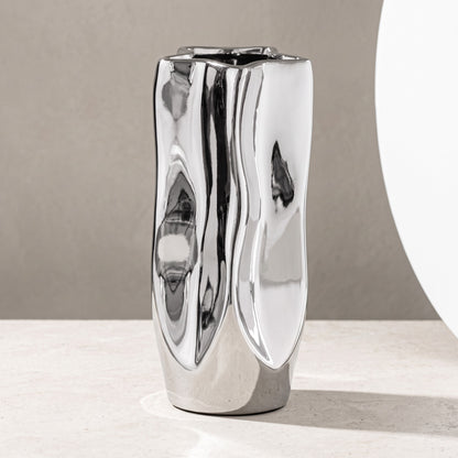 Narrow silver vase with crumpled electroplated finish