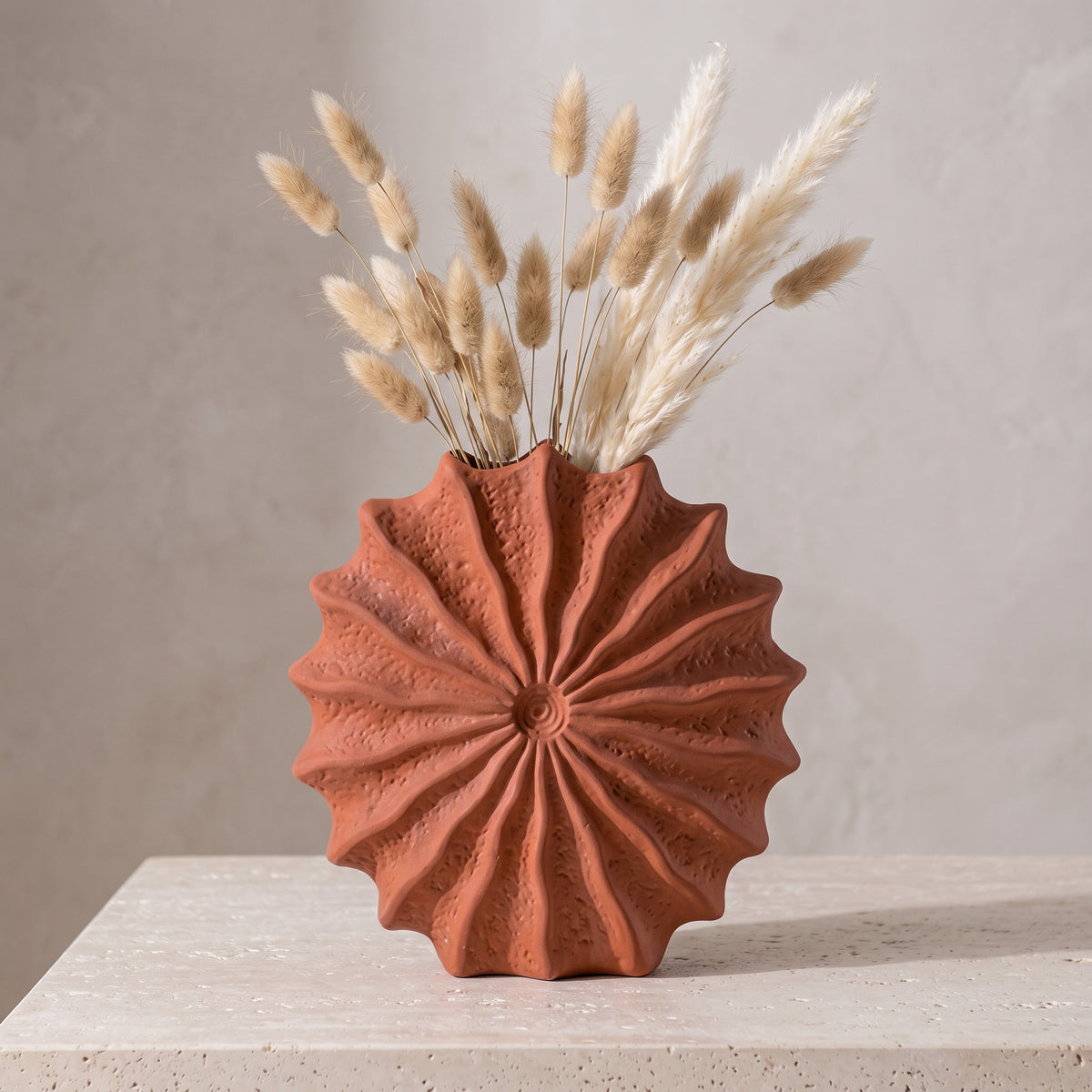 Sunburst vase holding dried bunny-tail grass (stems not included)